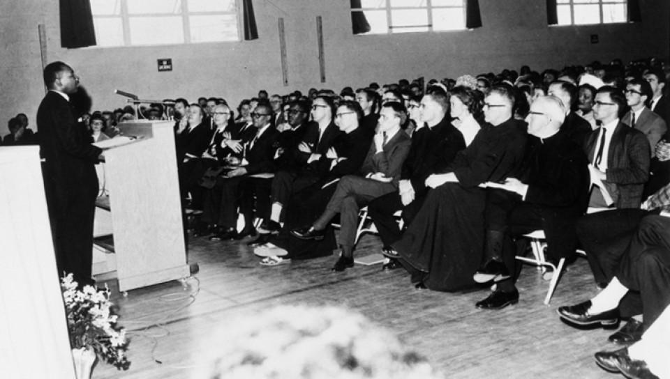  Dr. Martin Luther King Jr. speaks to an audience in 1964 at U N E’s precursor institution, St. Francis College